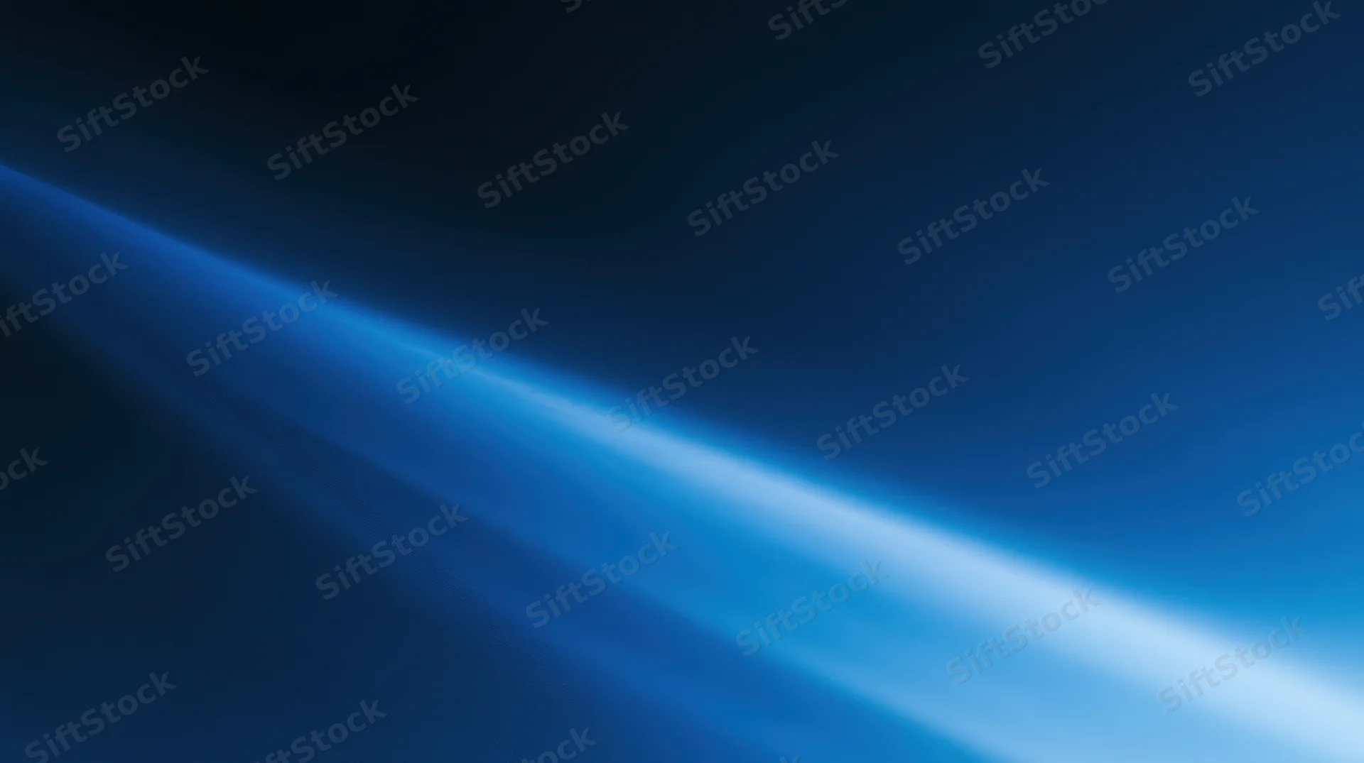 Diagonal blue light beam glowing across dark gradient background with soft luminous streaks and copyspace