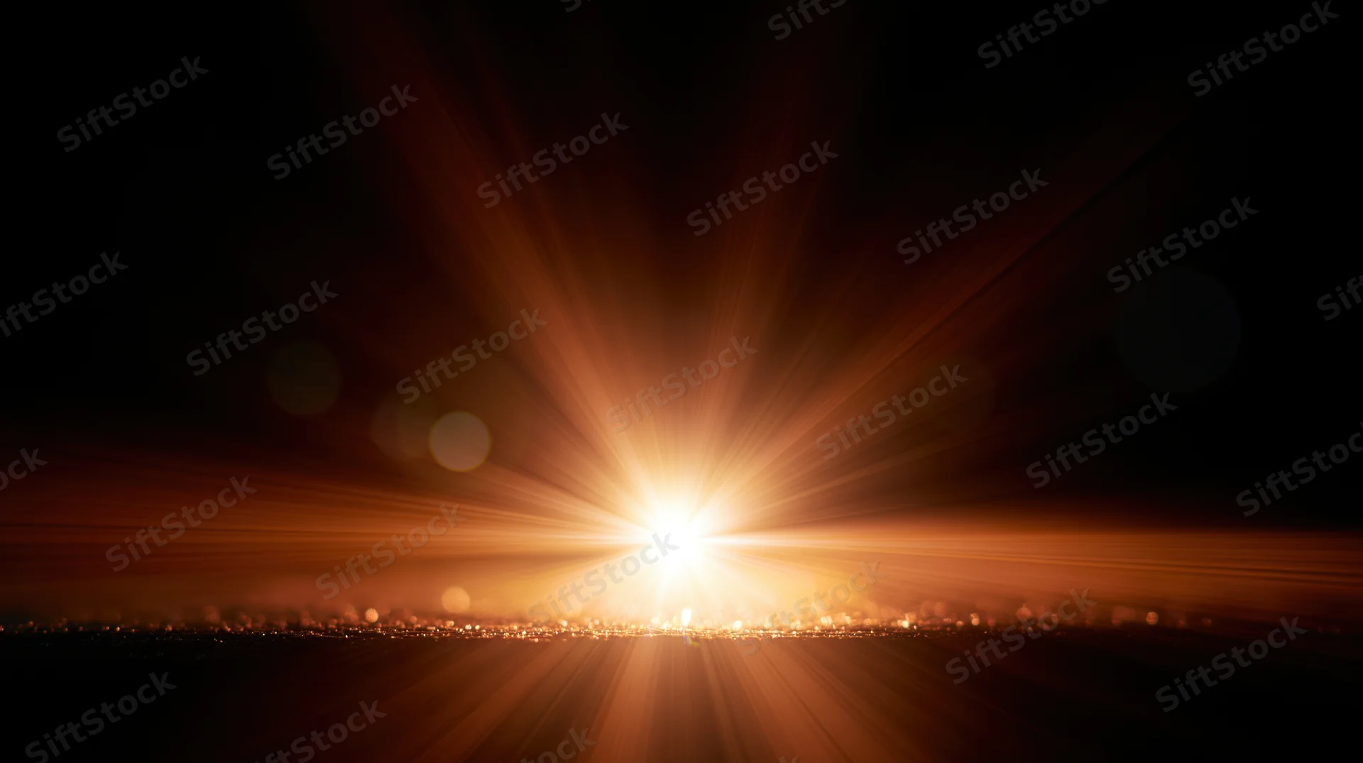 Bright sunrise with radiant beams over city skyline at dawn