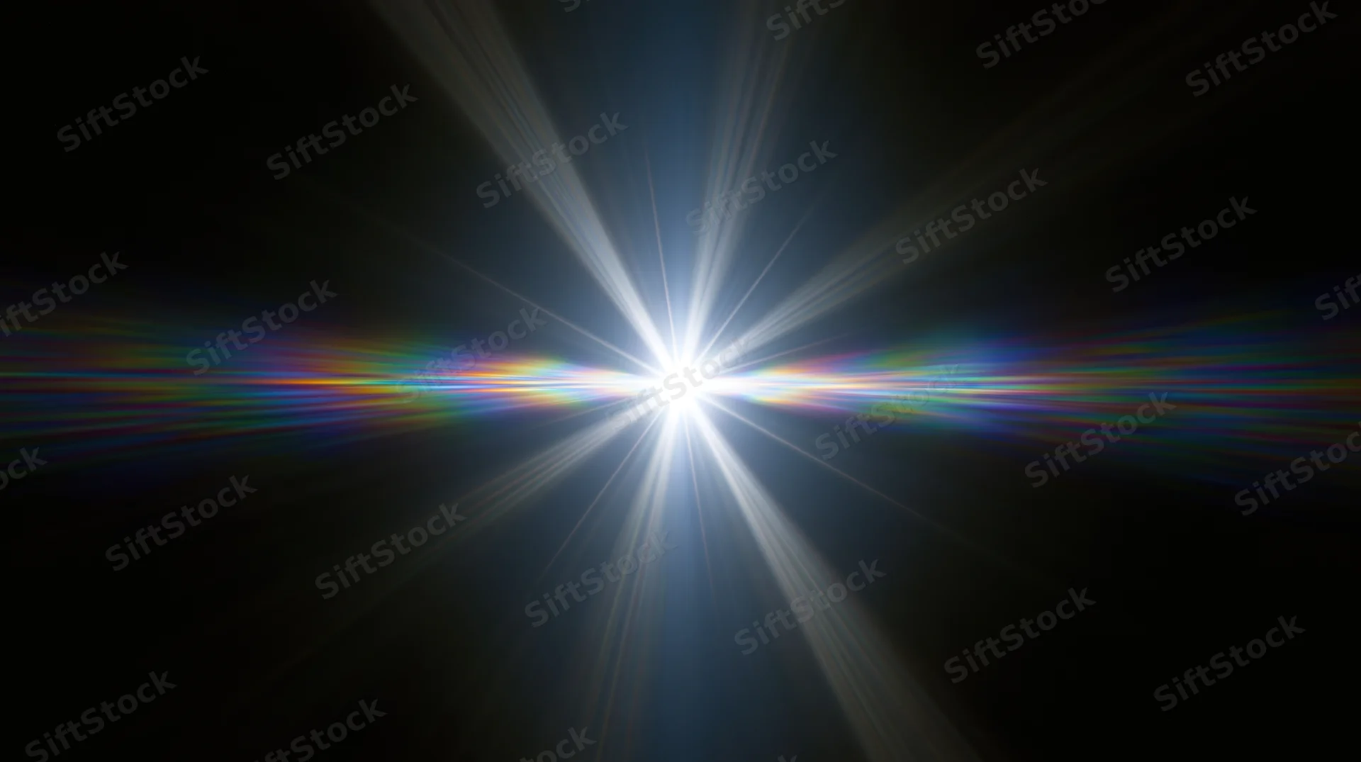 Bright white light burst with radial beams and rainbow flare against black background