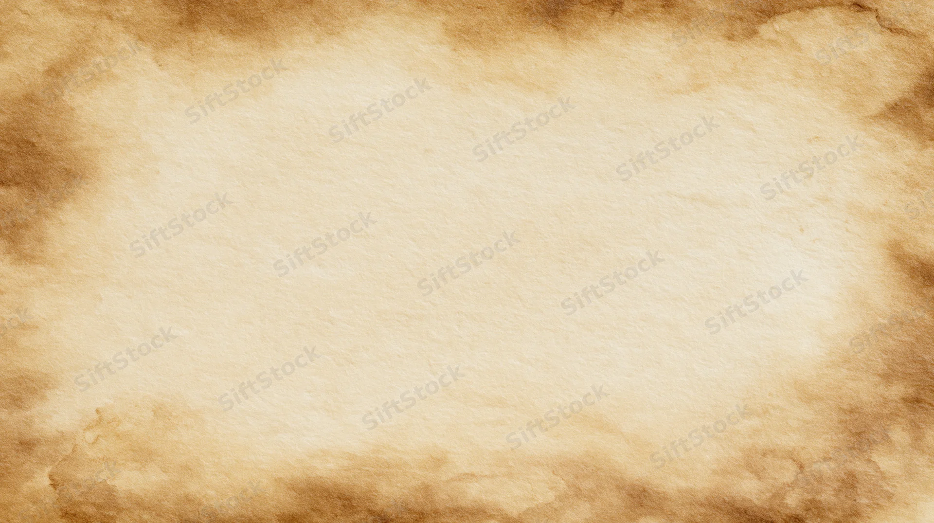 Aged parchment paper with burnt edges and central copyspace for text or design