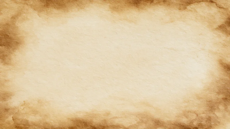 Aged parchment paper with burnt edges and central copyspace for text or design