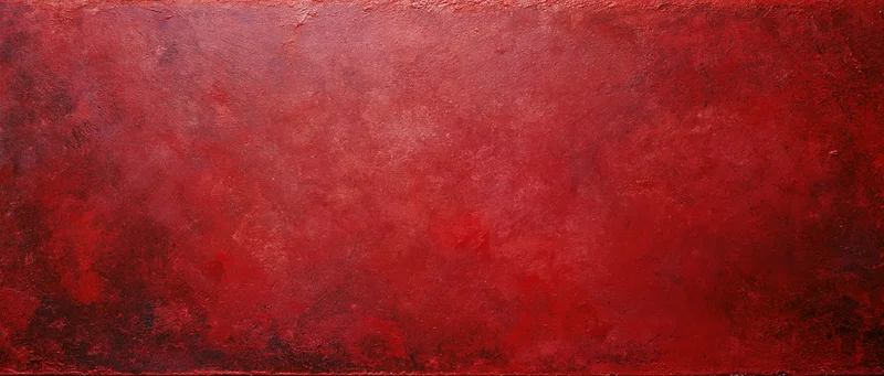 Textured red painted surface with abstract grunge finish as background