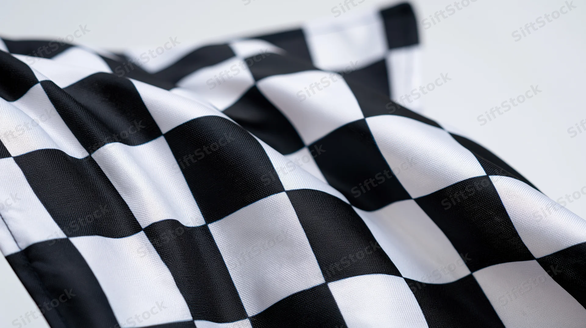 Checkered flag waving against a white background