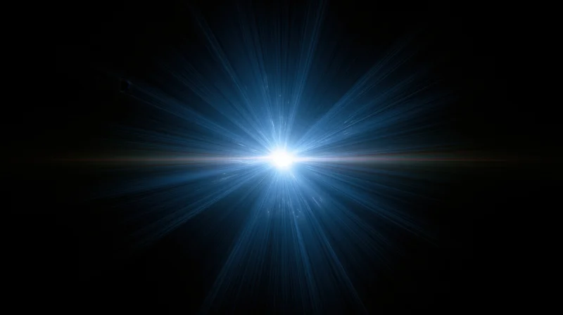Bright blue light burst radiating from center against dark background