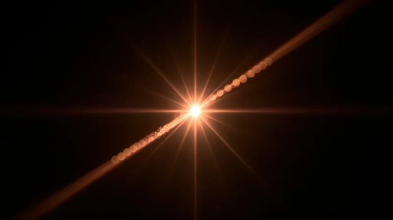 Bright starburst light flare with diagonal line of glowing circles on dark background