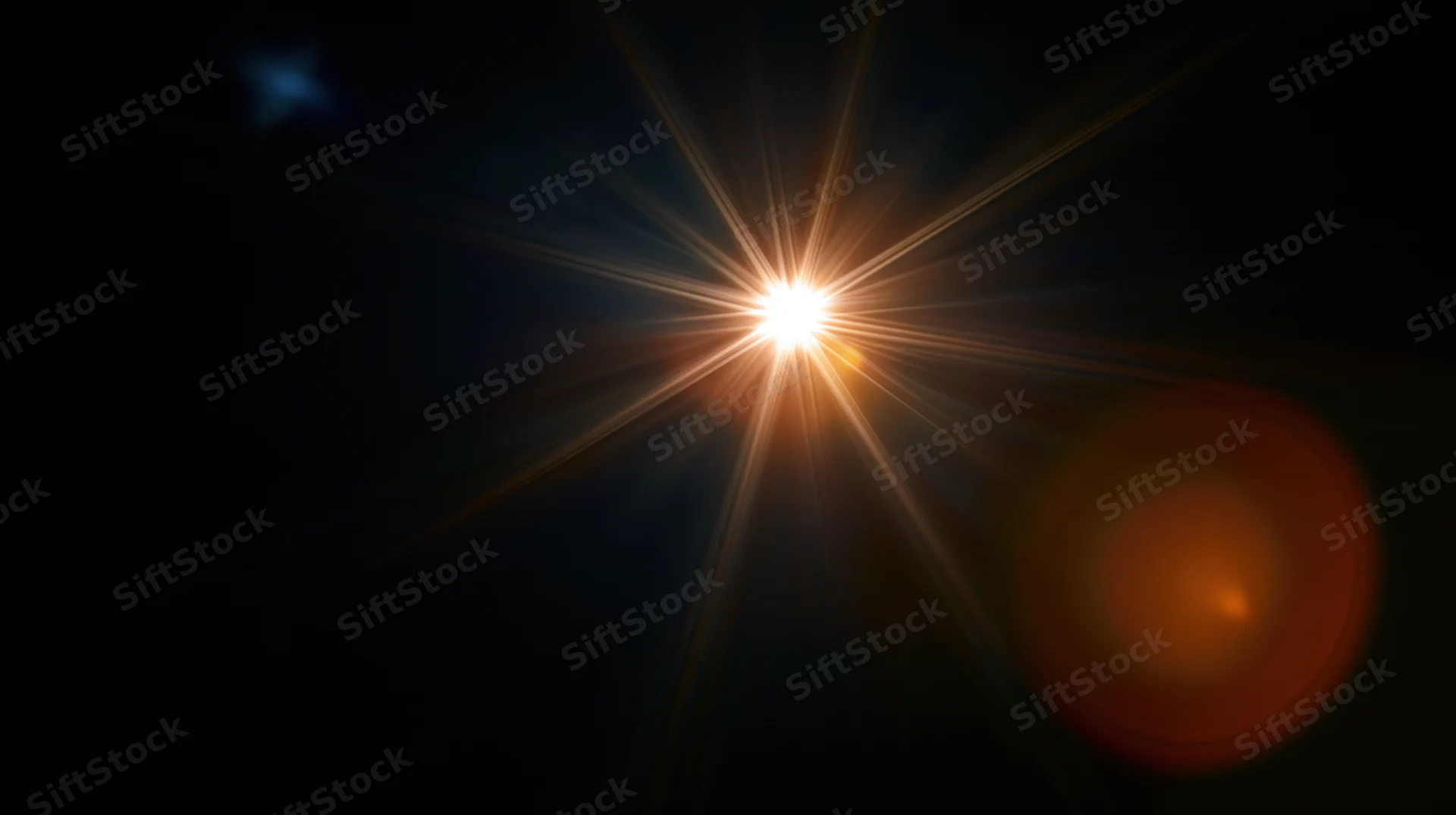 Bright star emitting radiant light beams in dark space with lens flare and bokeh effect