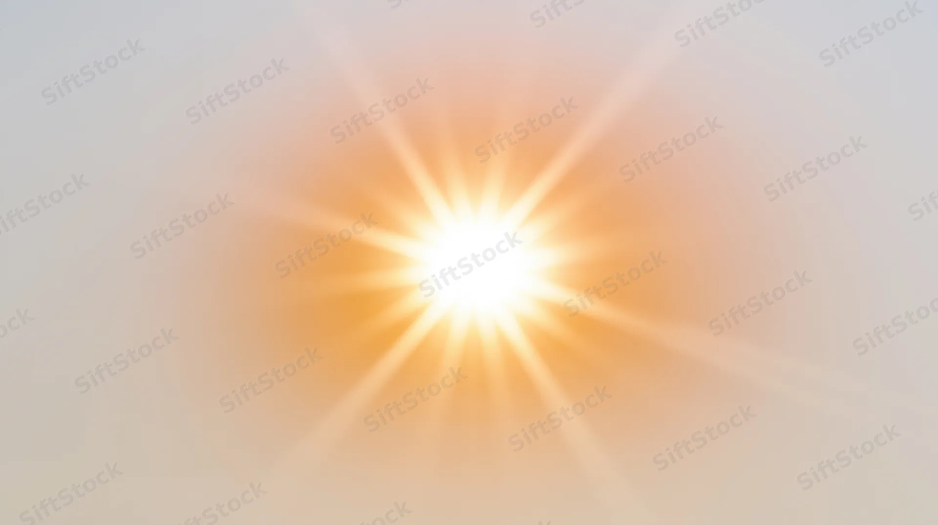 Bright sunburst radiating light against a soft gradient background