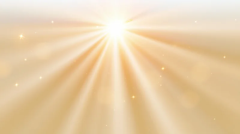Radiant golden light beams spreading outward in a soft glowing background