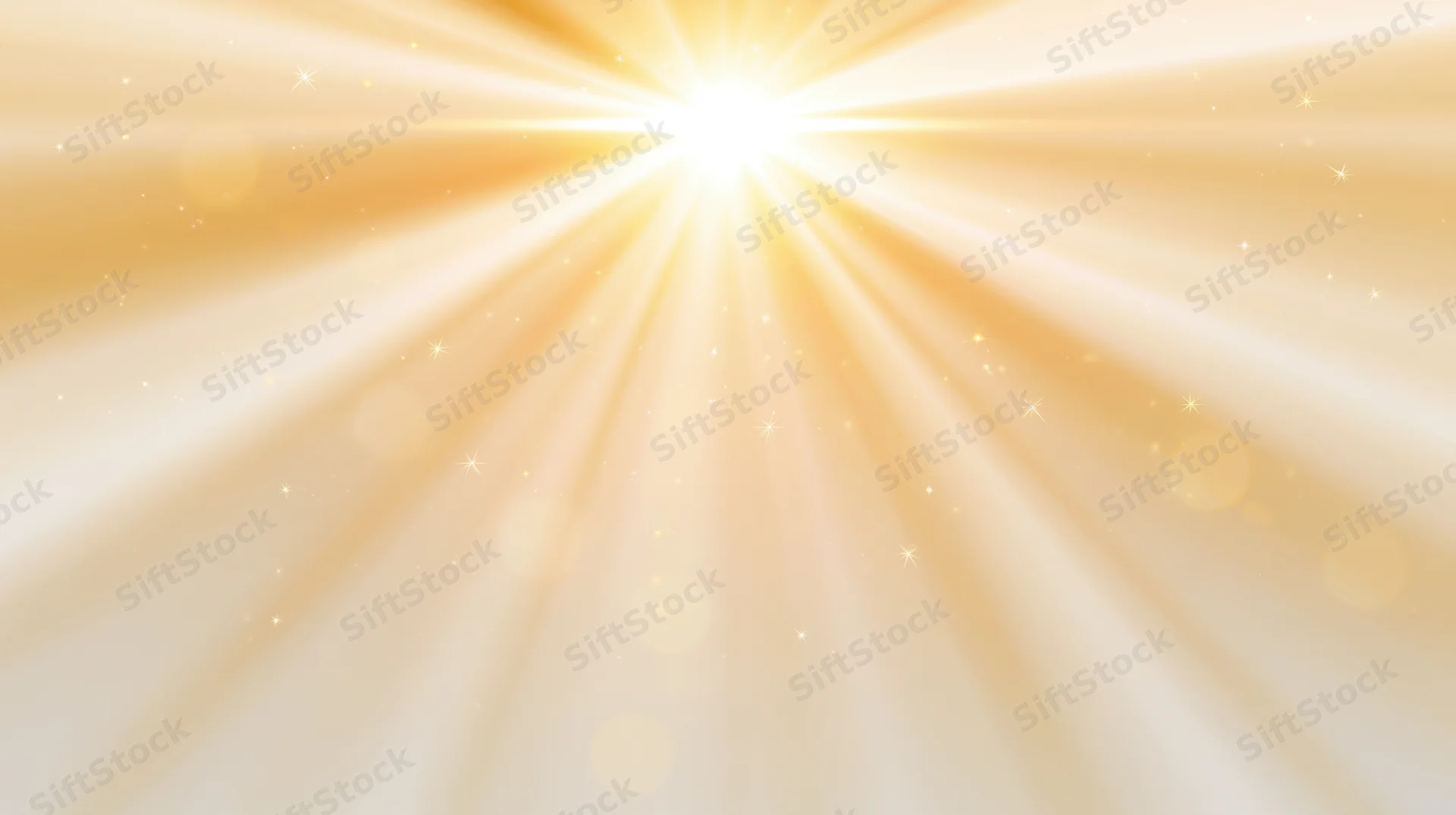 Radiant golden light bursting outward with sparkling particles and soft bokeh in a warm abstract background