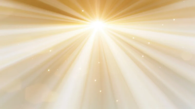 Radiant golden light bursting from center with soft glow and sparkling particles in abstract background
