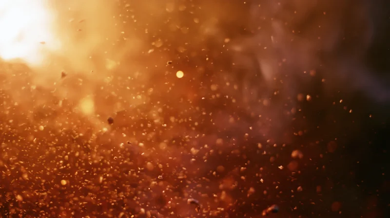 Golden light illuminating floating dust particles in warm atmospheric haze