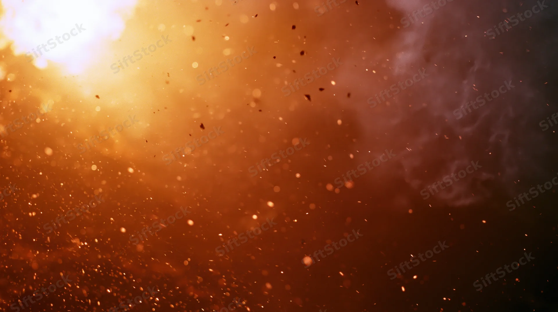 Fiery explosion with flying sparks and billowing smoke filling the frame