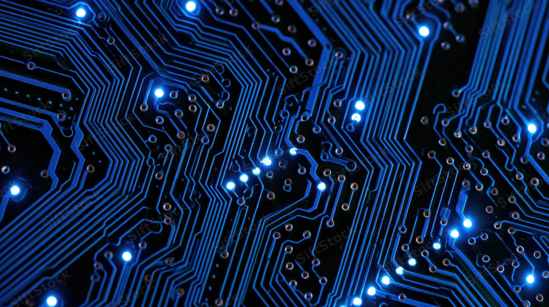 Illuminated blue circuit board with glowing connections and pathways