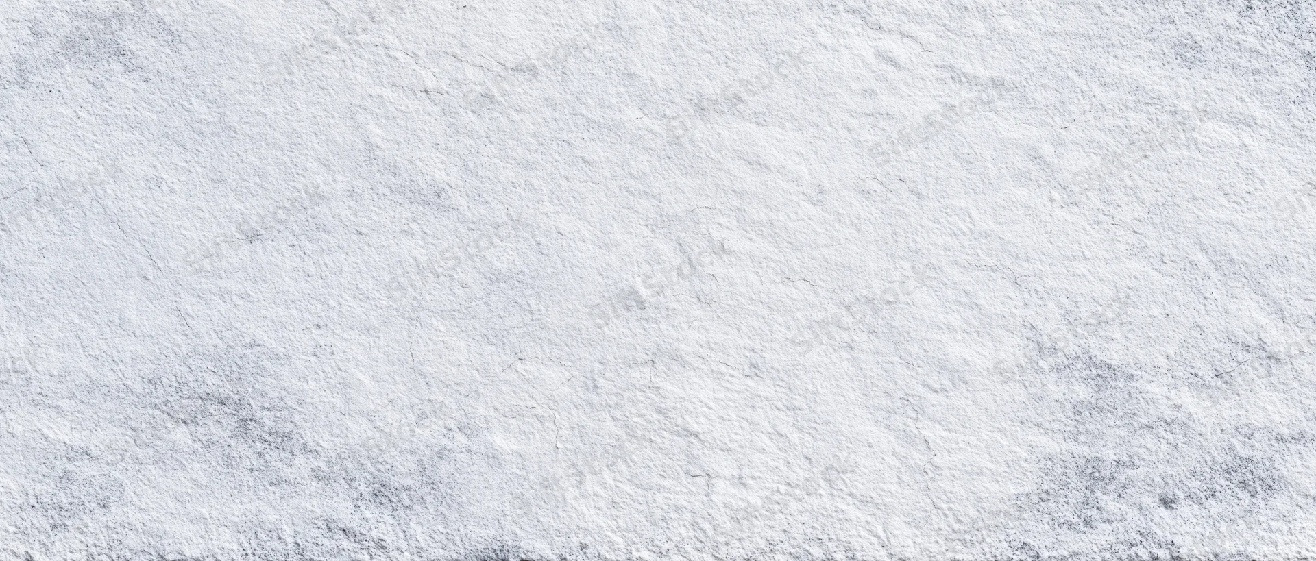 Close-up of a white textured stone wall surface