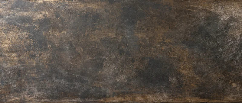Weathered metal surface with rust and scratches showing industrial wear and tear