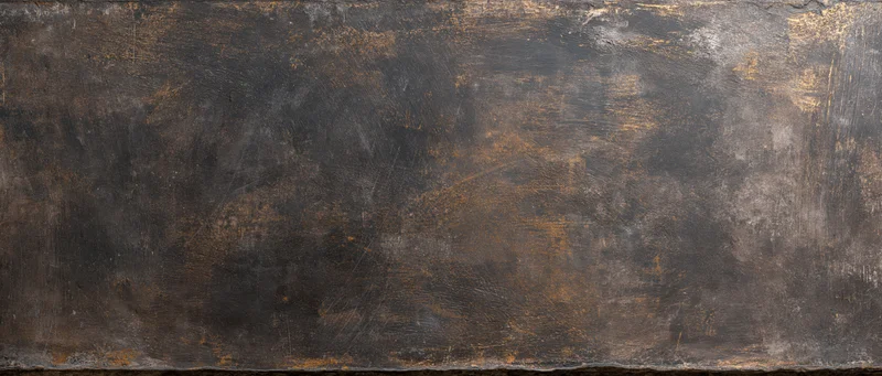 Weathered metal surface with rust and scratches showing signs of age and industrial use