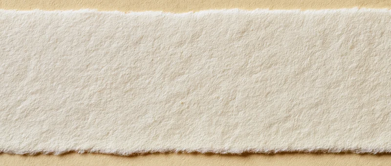 Textured wool felt strip on beige background with copyspace