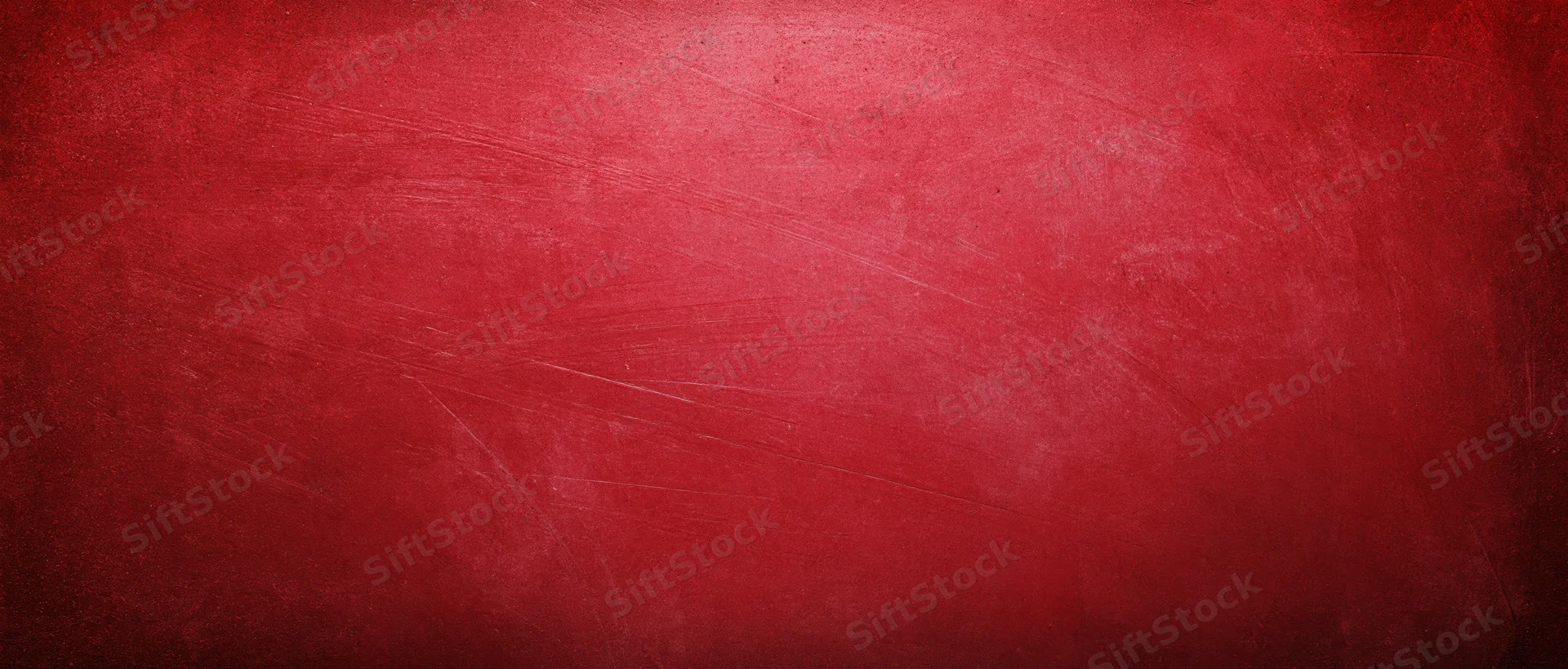 Red textured surface with scratches and wear as a background