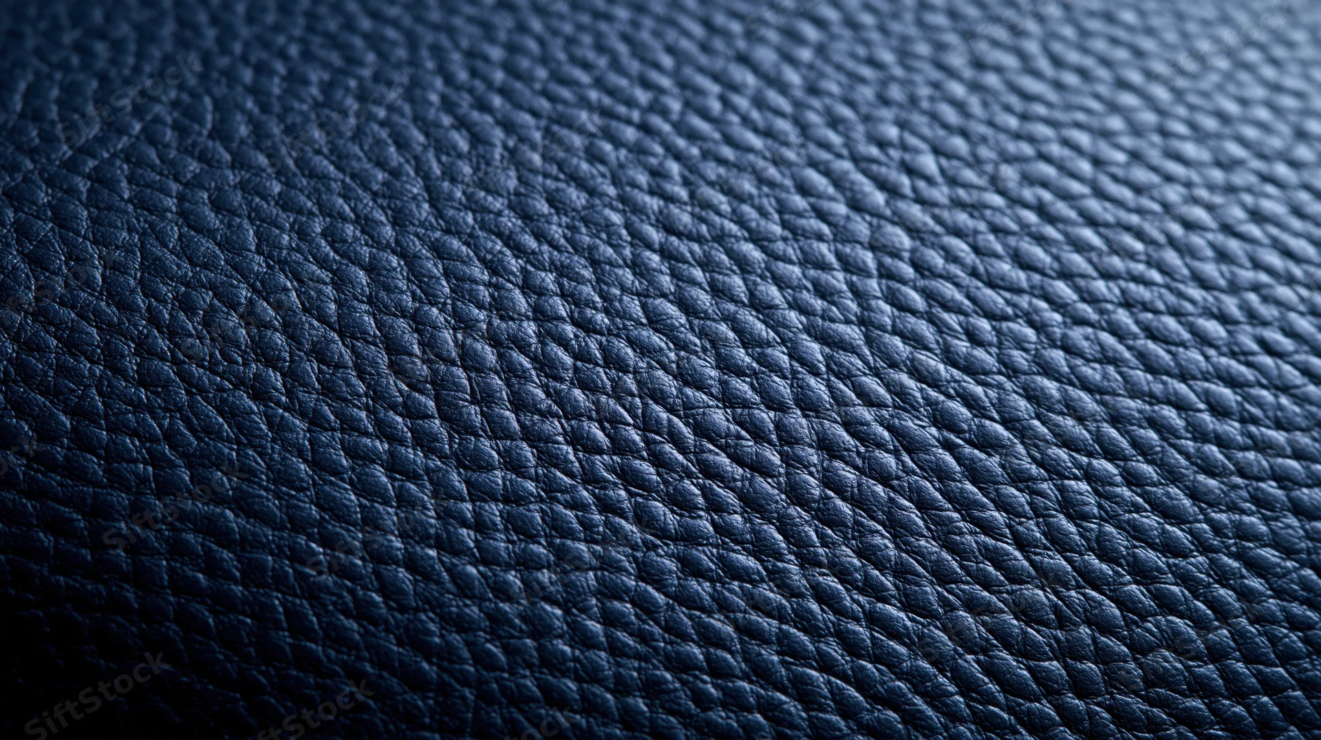 Closeup of blue textured leather surface showing pebbled grain pattern