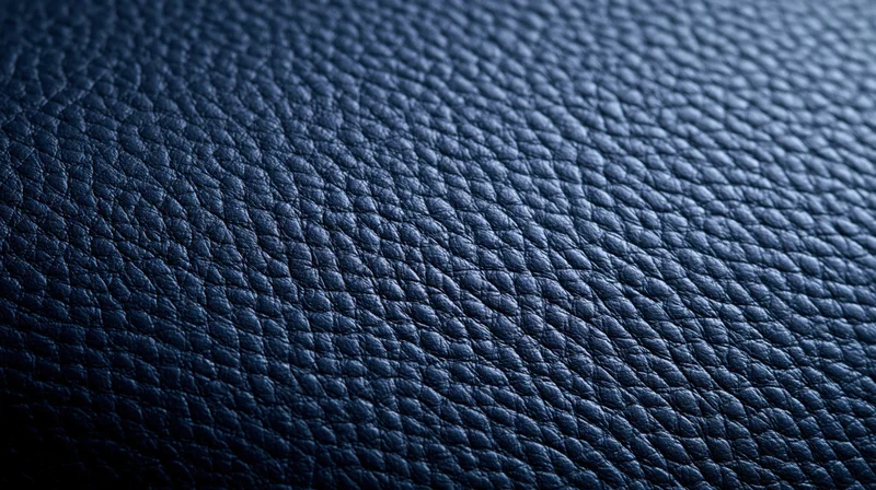 Closeup of blue textured leather surface showing pebbled grain pattern