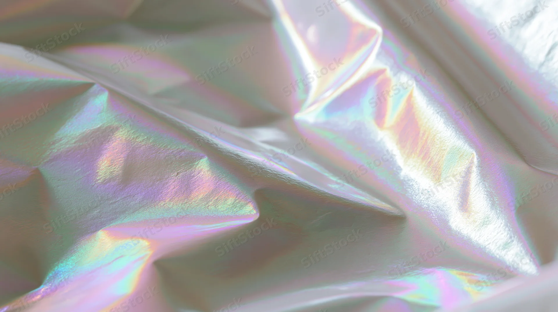 Crumpled iridescent fabric with shifting rainbow sheen and soft folds
