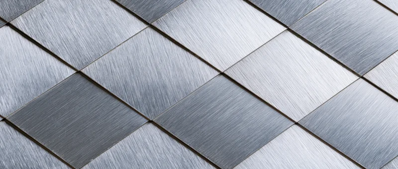 Brushed metal panels arranged in a diamond grid pattern as a seamless surface