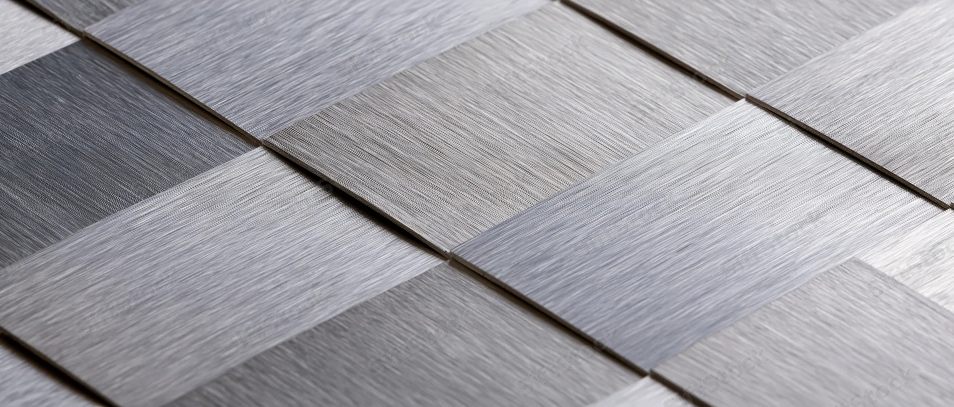 Gray textured tiles arranged in a geometric pattern for interior flooring
