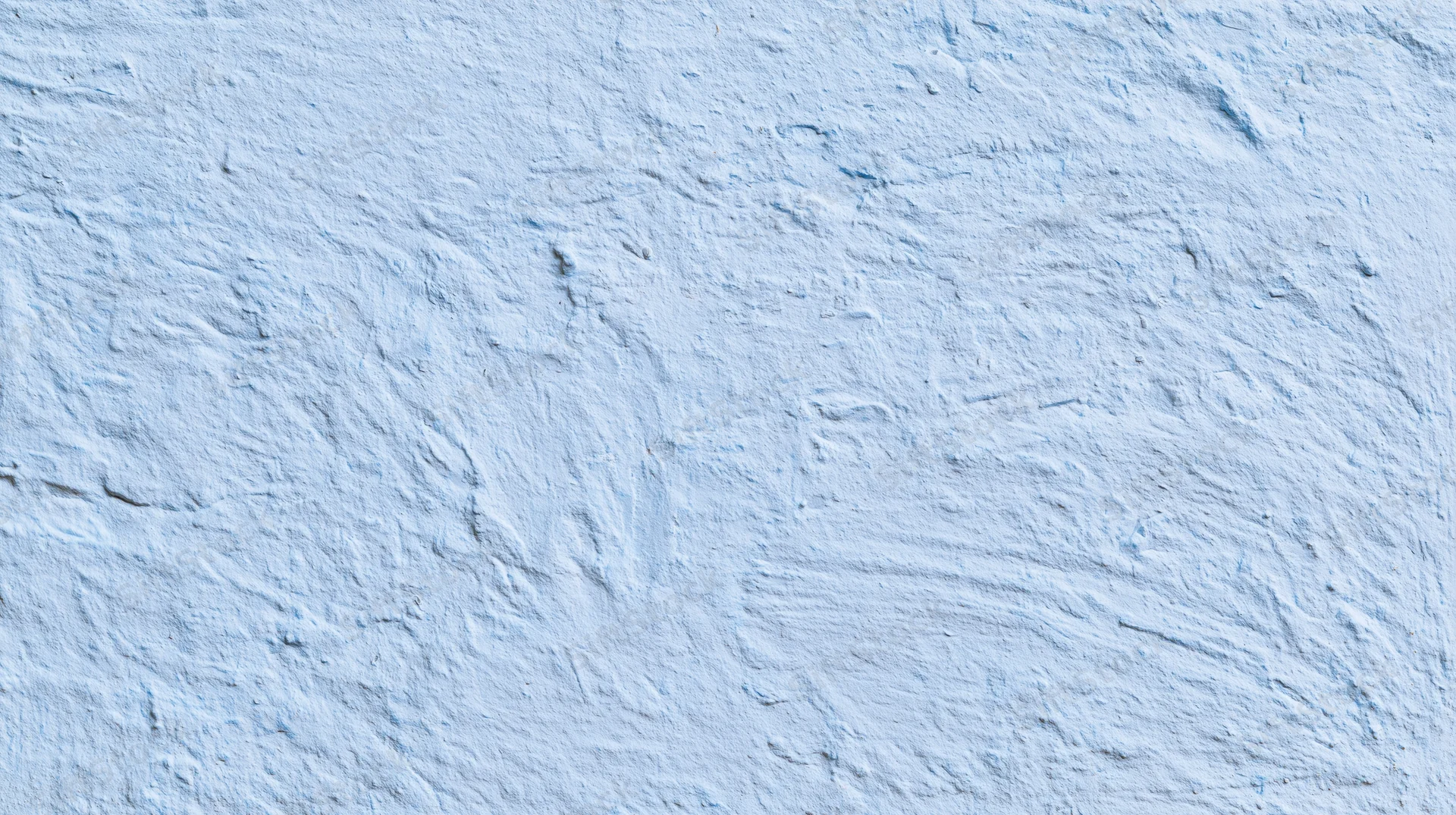 Textured blue plaster wall surface with rough uneven finish