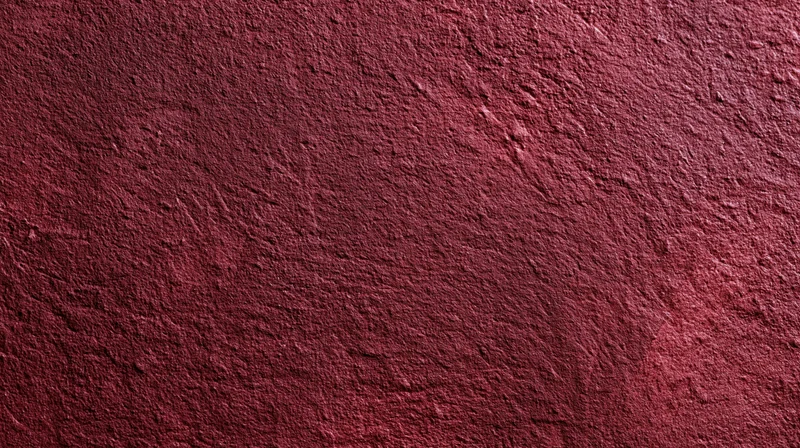 Closeup of a rough red plastered wall surface