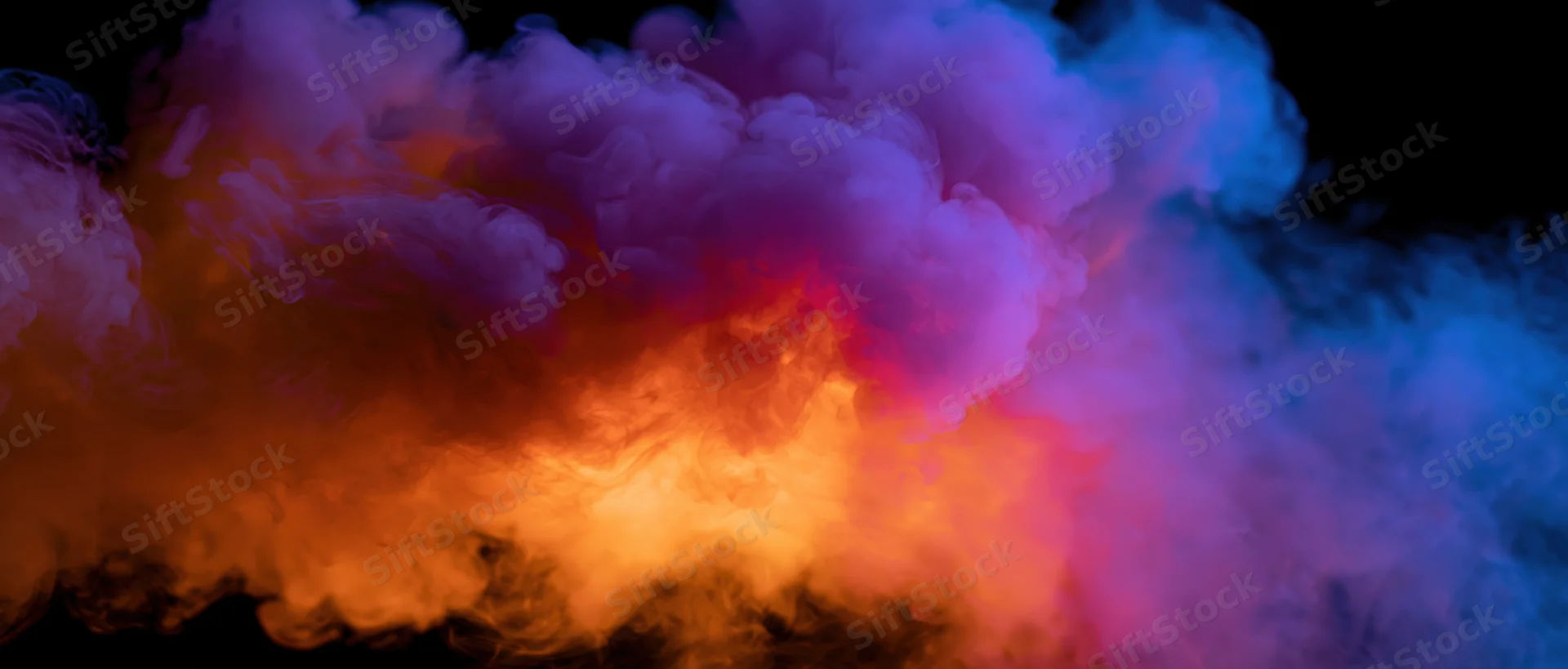 Swirling colorful smoke clouds against black background