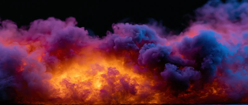 Swirling colorful smoke clouds glowing with orange light against dark background