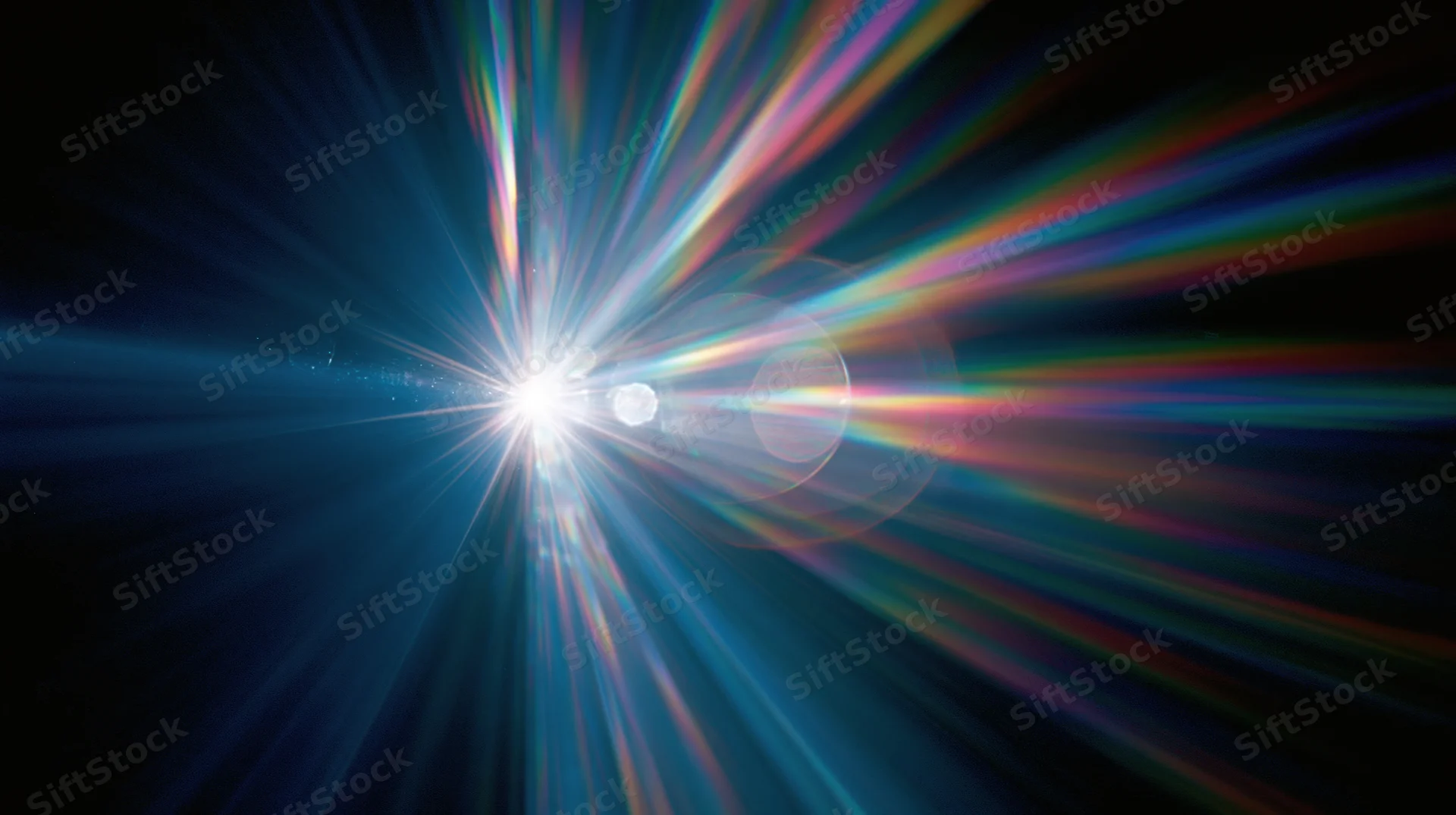 Radiant light burst with colorful beams spreading across dark background