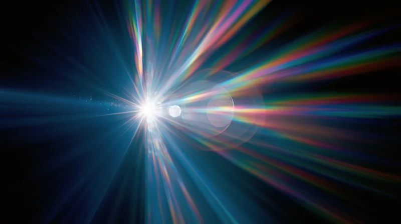 Radiant light burst with colorful beams spreading across dark background