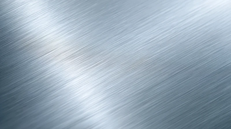 Brushed metal surface with diagonal texture and reflective sheen