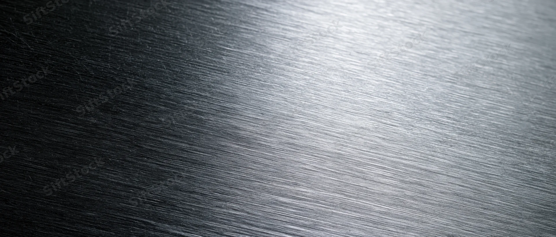 Brushed metal surface with linear texture and light gradient