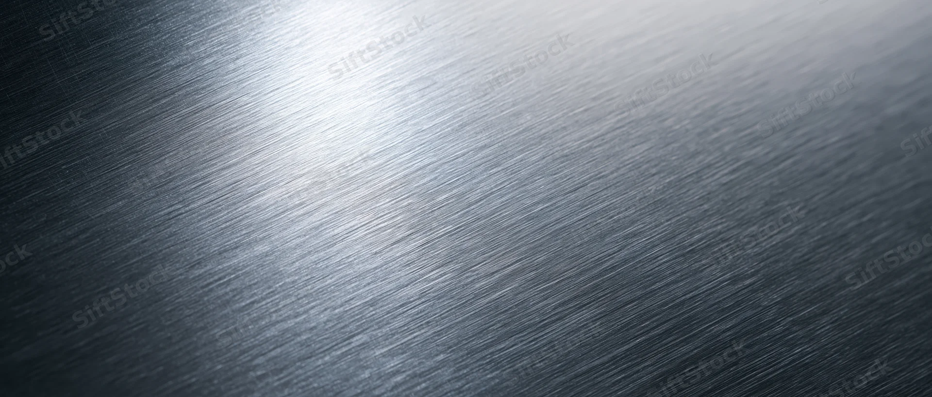Brushed metal surface with diagonal texture and reflective sheen