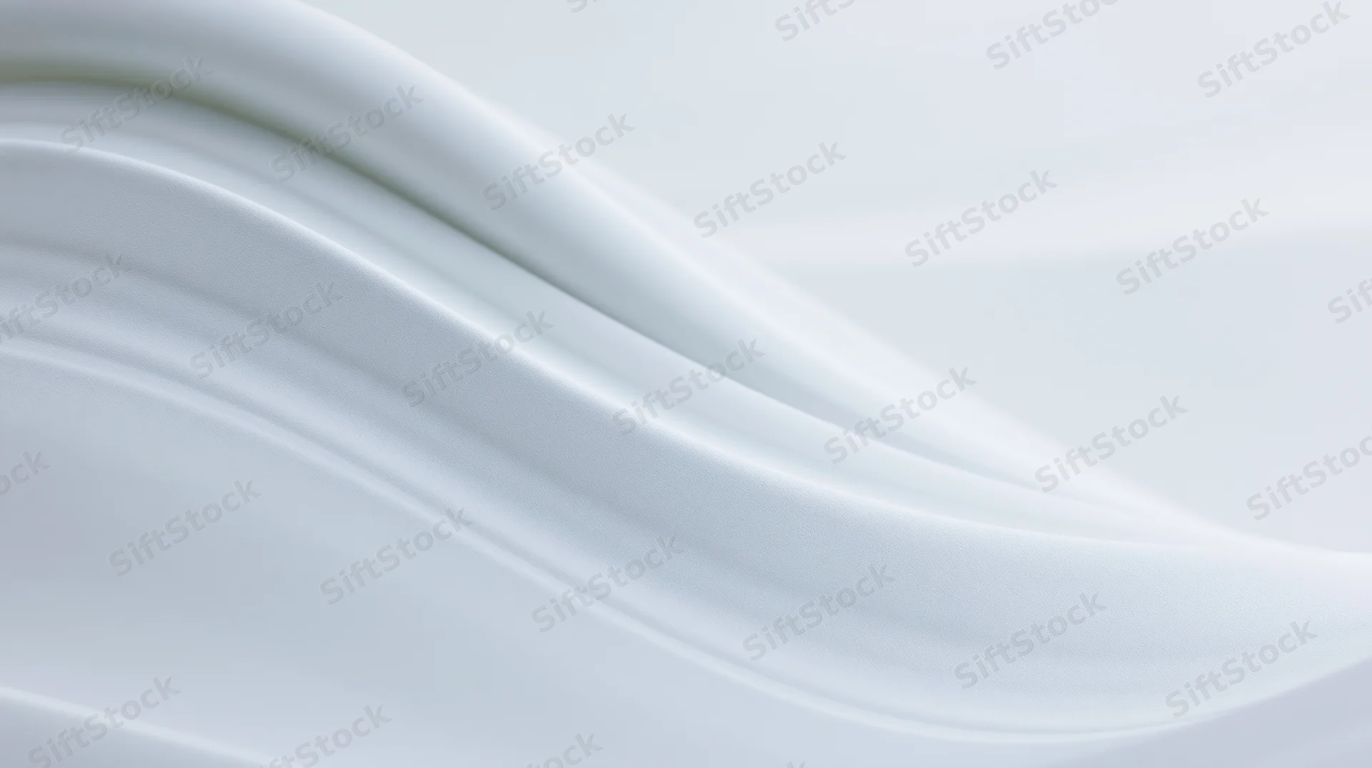 Smooth white flowing waves forming a glossy abstract surface