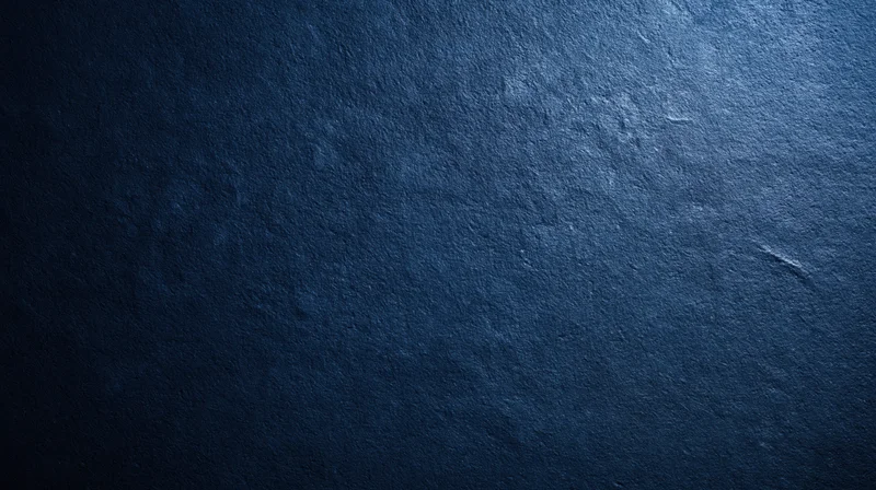 Dark blue textured stone surface with subtle gradient and copyspace