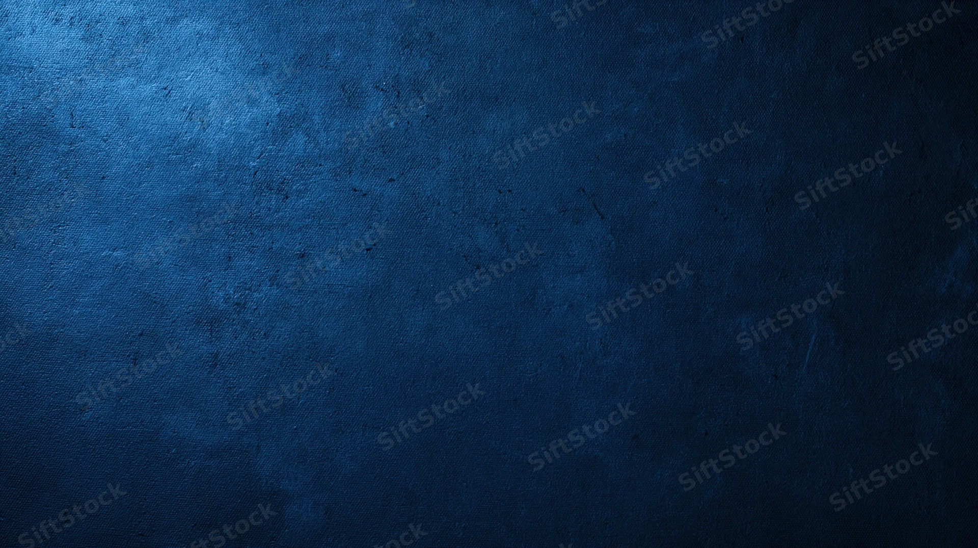 Dark blue textured surface with subtle gradient and fabric weave pattern