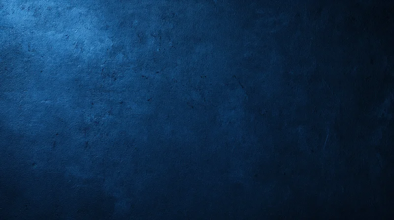 Dark blue textured surface with subtle gradient and fabric weave pattern