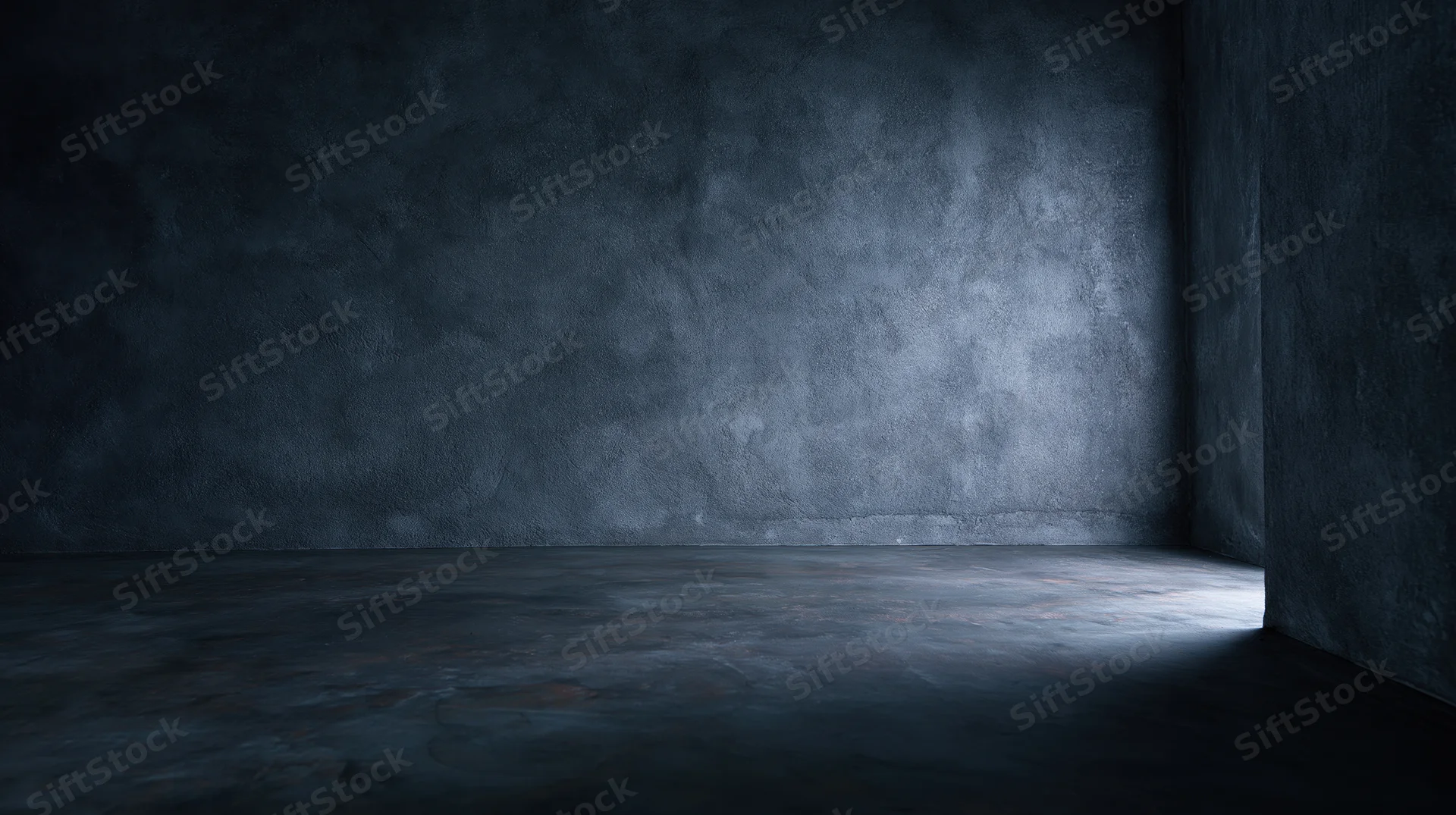 Empty concrete room with spotlight on corner floor and dark walls