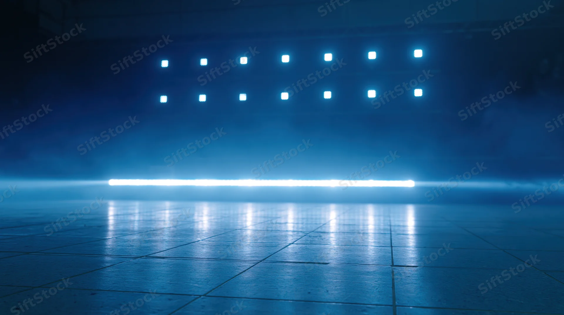 Blue neon lights arranged in grid and horizontal beam reflecting on tiled floor in smoky studio space