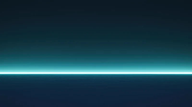 A calm ocean surface under a dark teal sky with a glowing horizon line