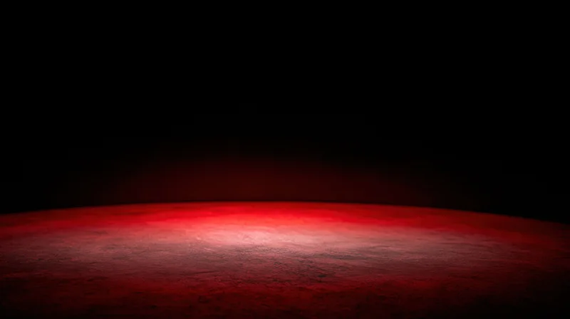 Curved red surface glowing at the horizon against a dark background