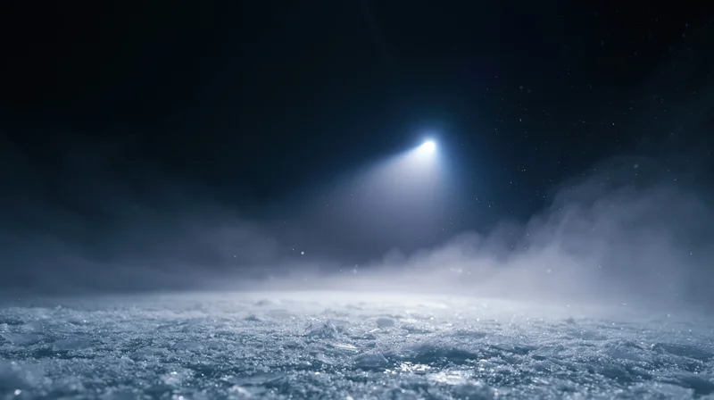 Spotlight beam illuminating icy frozen surface at night in arctic environment
