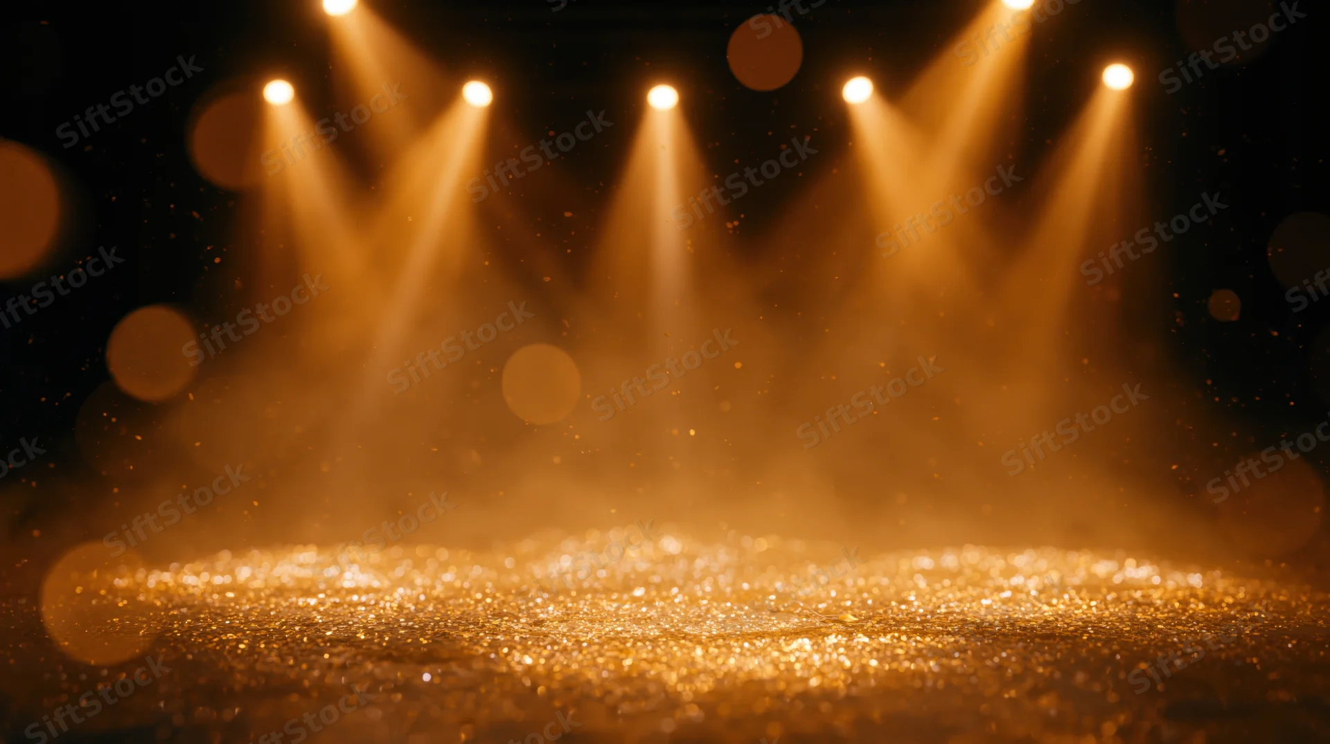 Golden stage lit by spotlights with sparkling particles and warm glow, creating a theatrical ambiance