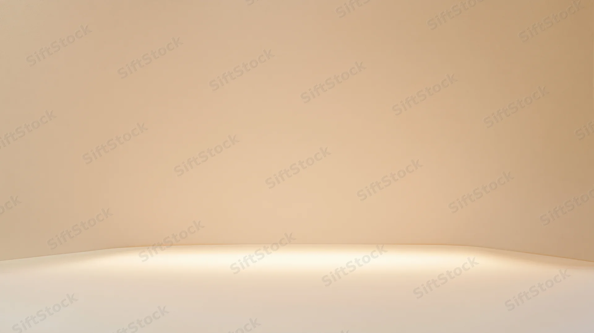Curved beige studio wall and floor with soft warm lighting and copyspace