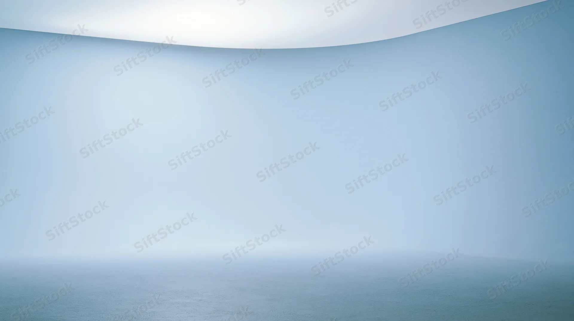 A curved blue gradient surface with soft light and foggy horizon over calm water