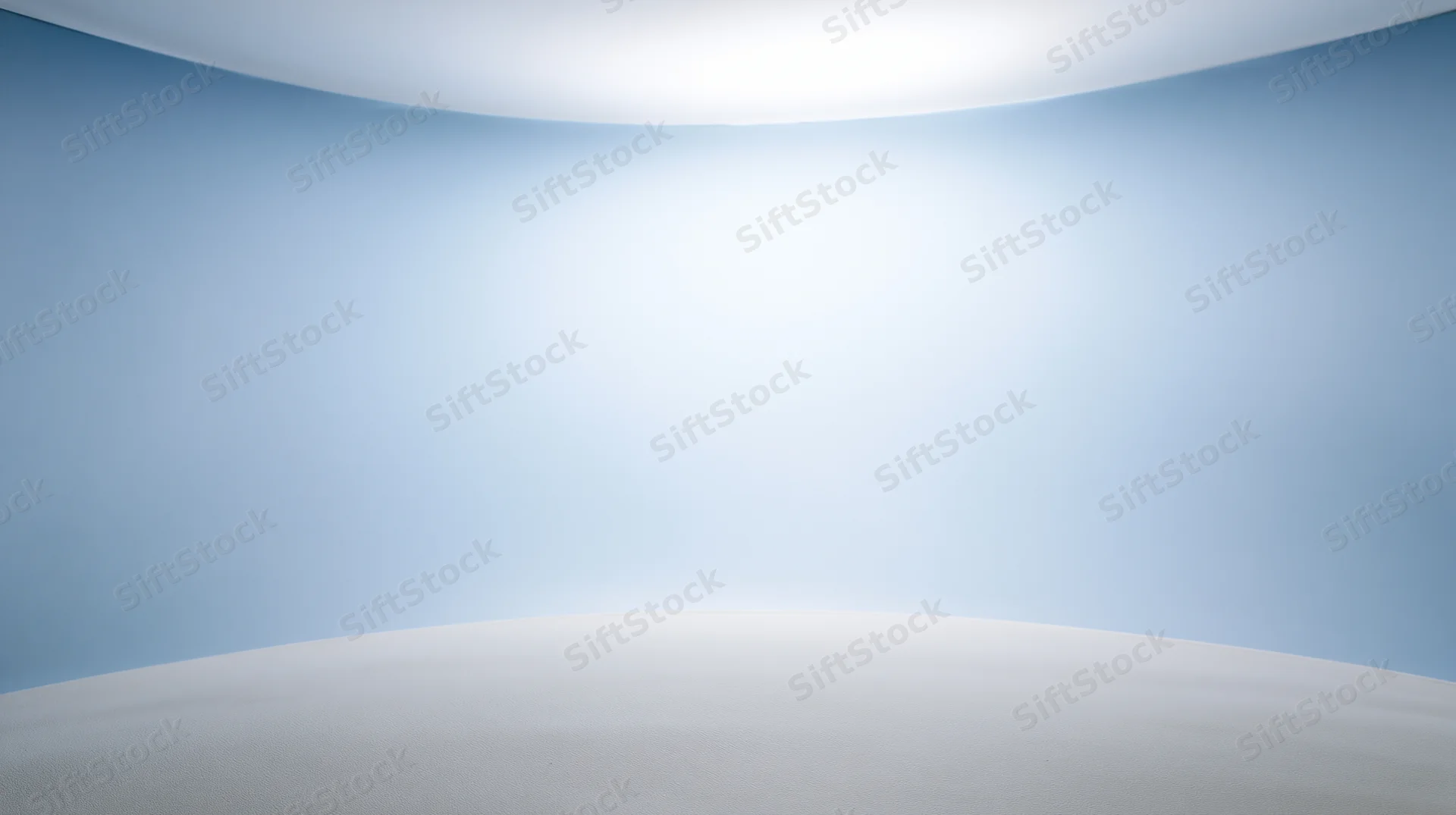 Curved blue and white seamless studio backdrop with soft lighting and empty space for product display