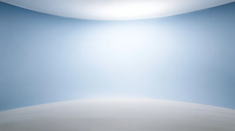 Curved blue and white seamless studio backdrop with soft lighting and empty space for product display